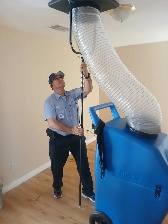Mini Split Installation technician using HEPA equipment in Gray